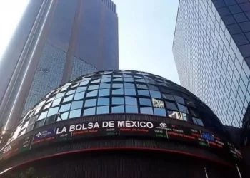 Stock exchange building with a glass dome and a wrapping stock ticker that reads 'LA BOLSA DE MEXICO' in Mexico City.